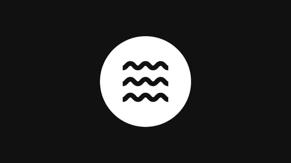 Three wavy, horizontal, parallel black lines depicting a medium level of firmness.