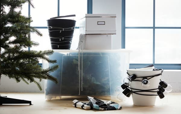Time to pack and store your holiday decorations? IKEA has a lot of smart storage and organisation ideas for small spaces. Put big and awkward-shaped items inside a big transparent storage box and wind your lighting chain round a bin.