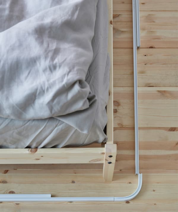 To put up canopy bed curtains, place the tracks around your bed to determine where you want the curtains. If the pieces overlap, cut them to size. VIDGA corner piece single track in white lets you really surround your bed with continous curtains.