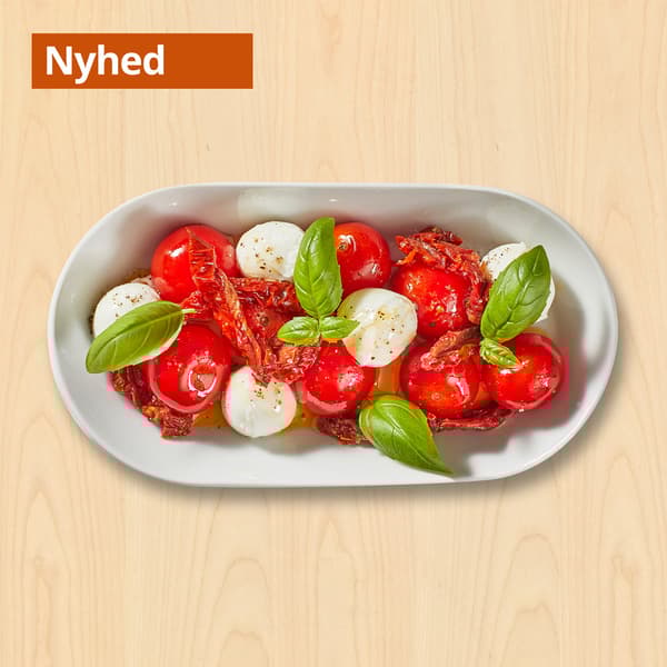 Tomat- og mozzarellasalat
med soltørrede tomater, pesto og basilikum

25.-