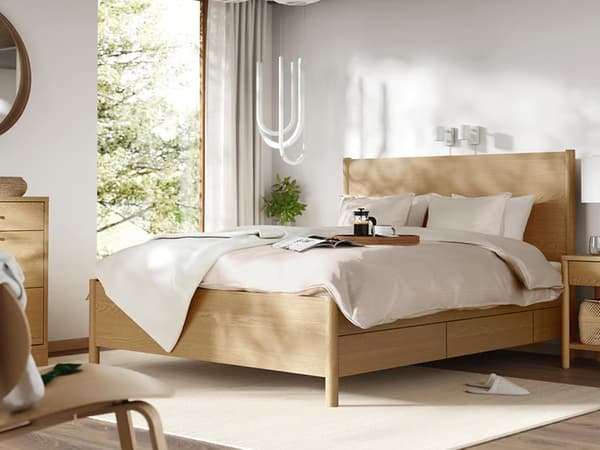 TONSTAD bedframe in bedroom setting with a bedside table. 