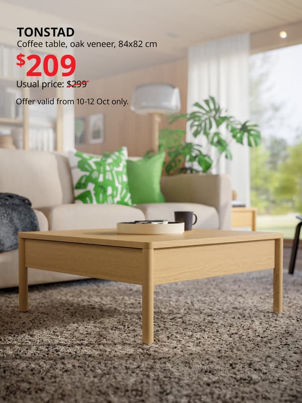 TONSTAD coffee table in living room on top of rug, oak veneer, 84x82 cm. Usual price with slash: $299. 10.10 price: $209. IKEA Alexandra birthday sale, 10.10 sale