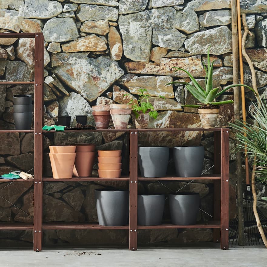 TORDH outdoor shelving racks system with pots and plants in garden area
