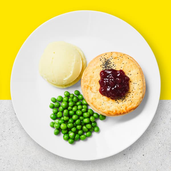 Traditional spiced curry with tender chunks of plant-based chick'n' served with creamy mashed potatoes or crunch potato chips and peas.