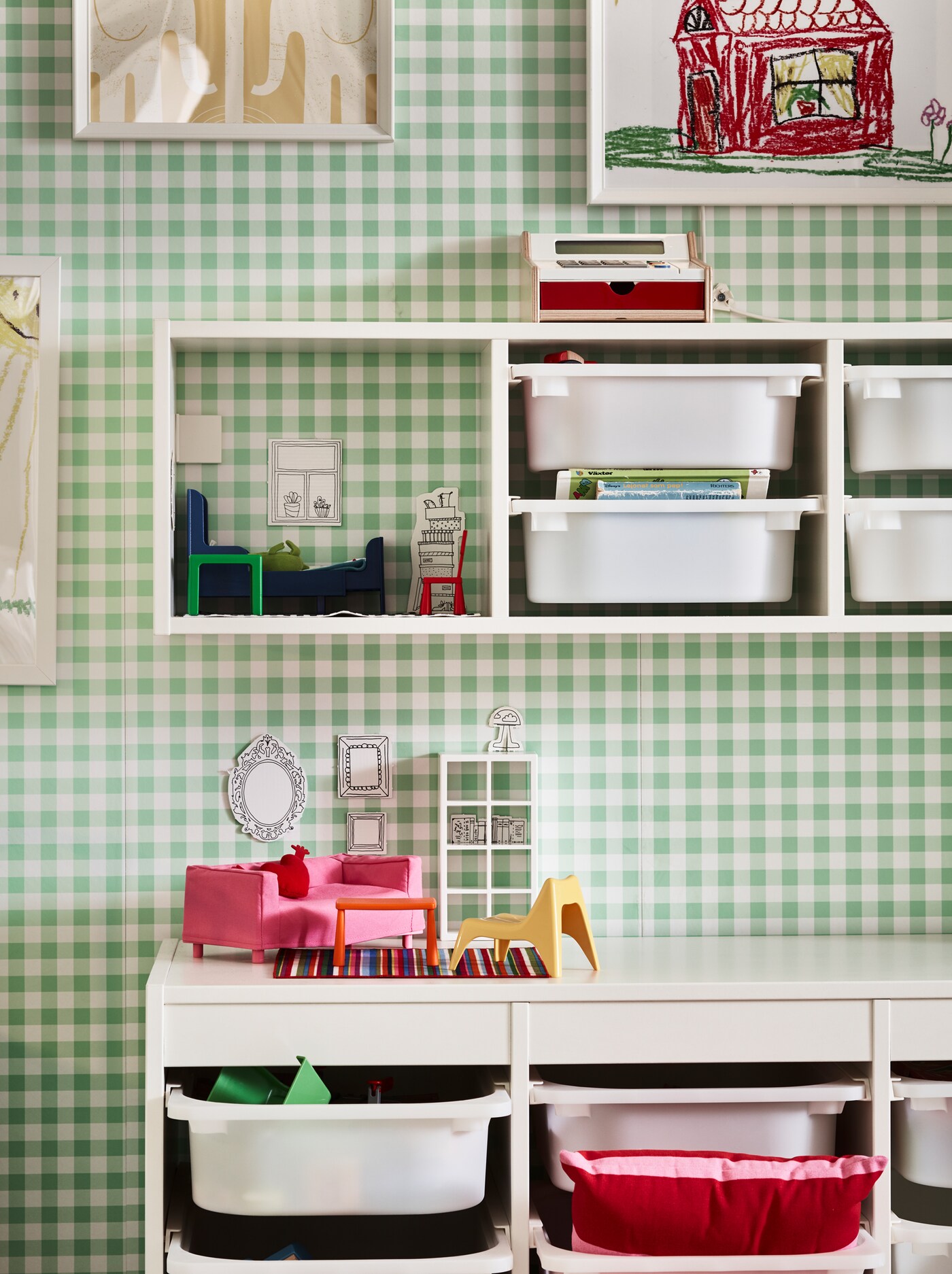 TROFAST boxes in white are neatly stacked in TROFAST frames that are mounted on the wall and on the floor.