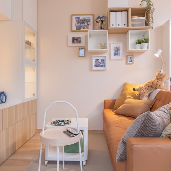TV wall unit with cabinets, display shelves, and home decor.
