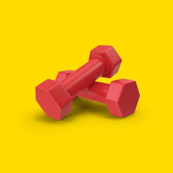 Två röda hantlar med sexkantiga ändar, liggande på gul yta.