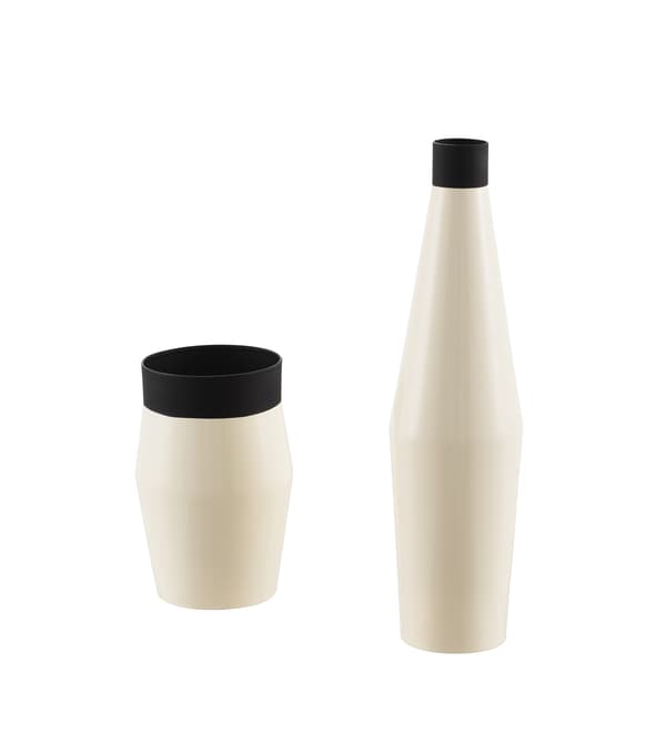 Two black and ivory vases in different shapes.