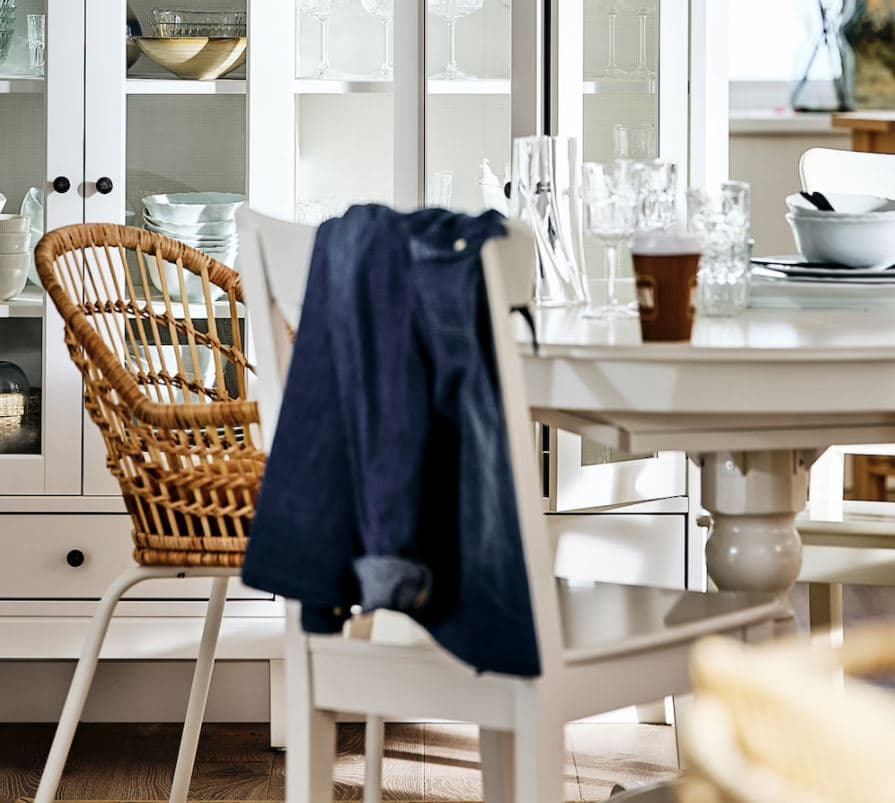 two chairs and one table in a dining room