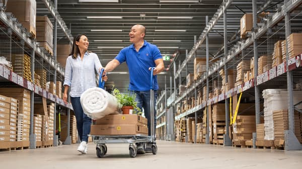 Two customers collecting their IKEA purchase in-store