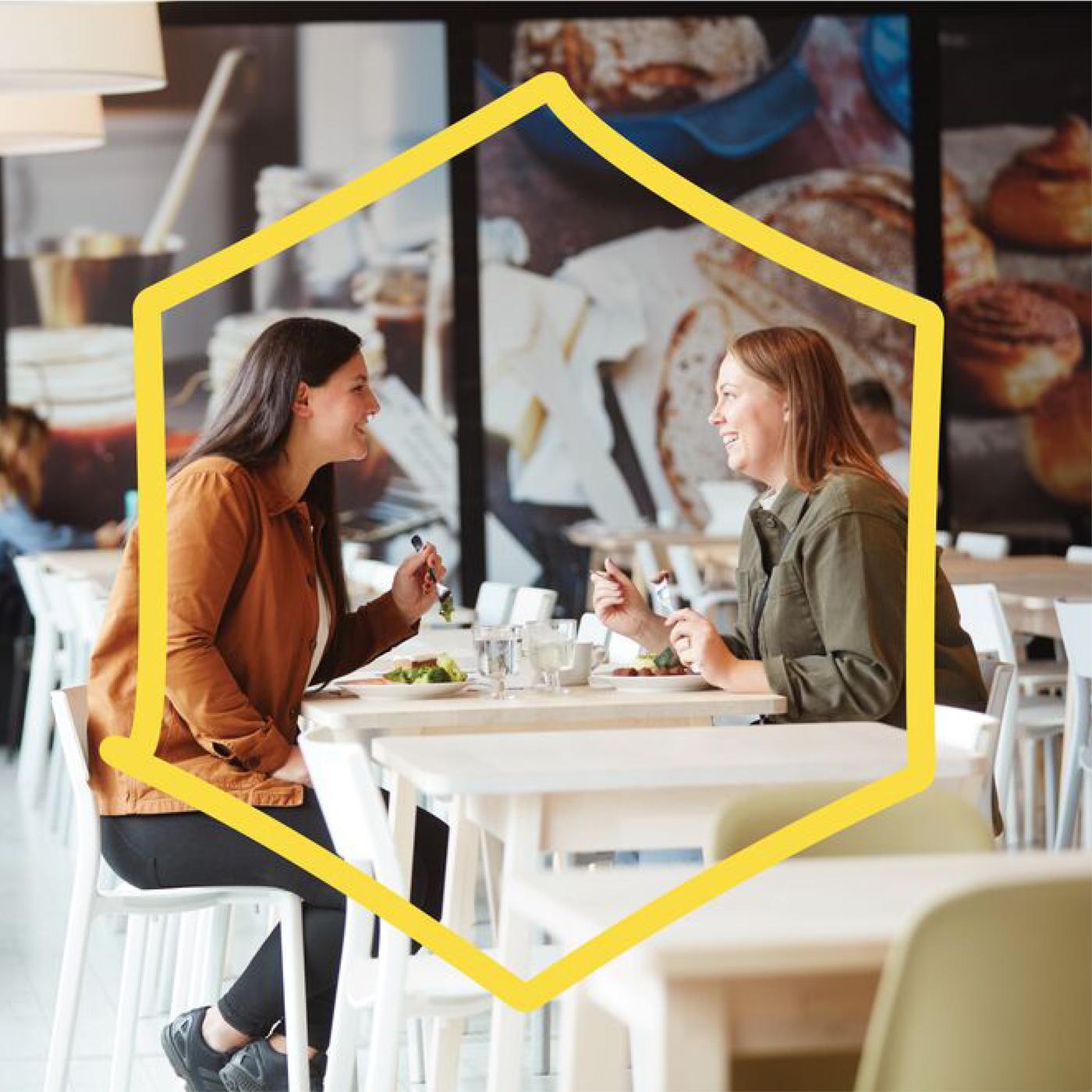 Two customers eating at the Swedish restaurant.