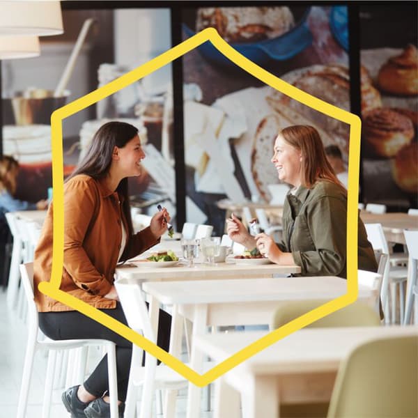 Two customers eating at the Swedish restaurant.