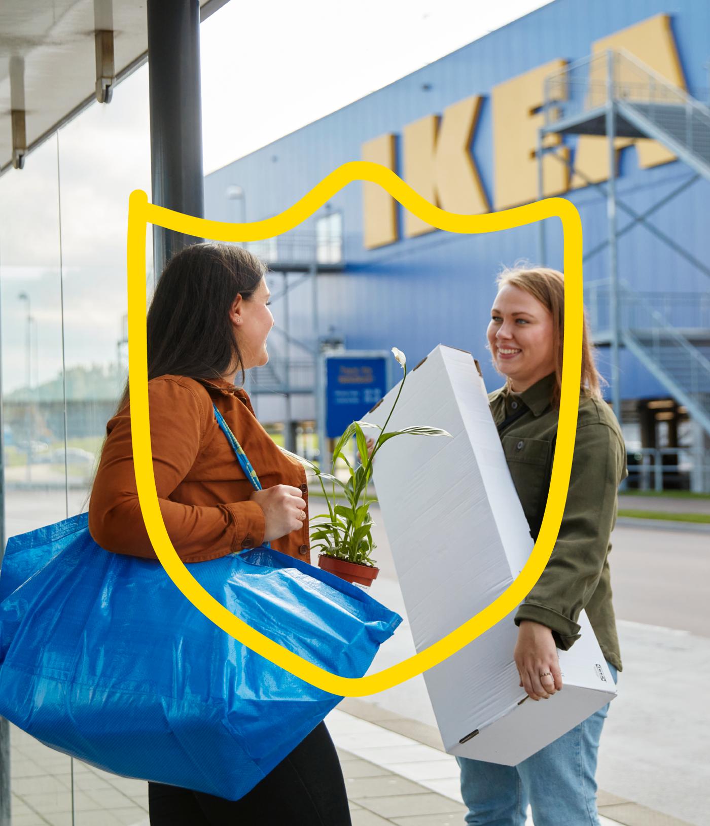 Two customers outside of an IKEA store chatting