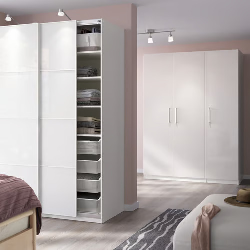 Two different PAX frames in the bedroom area, with sliding doors and hinged doors. 