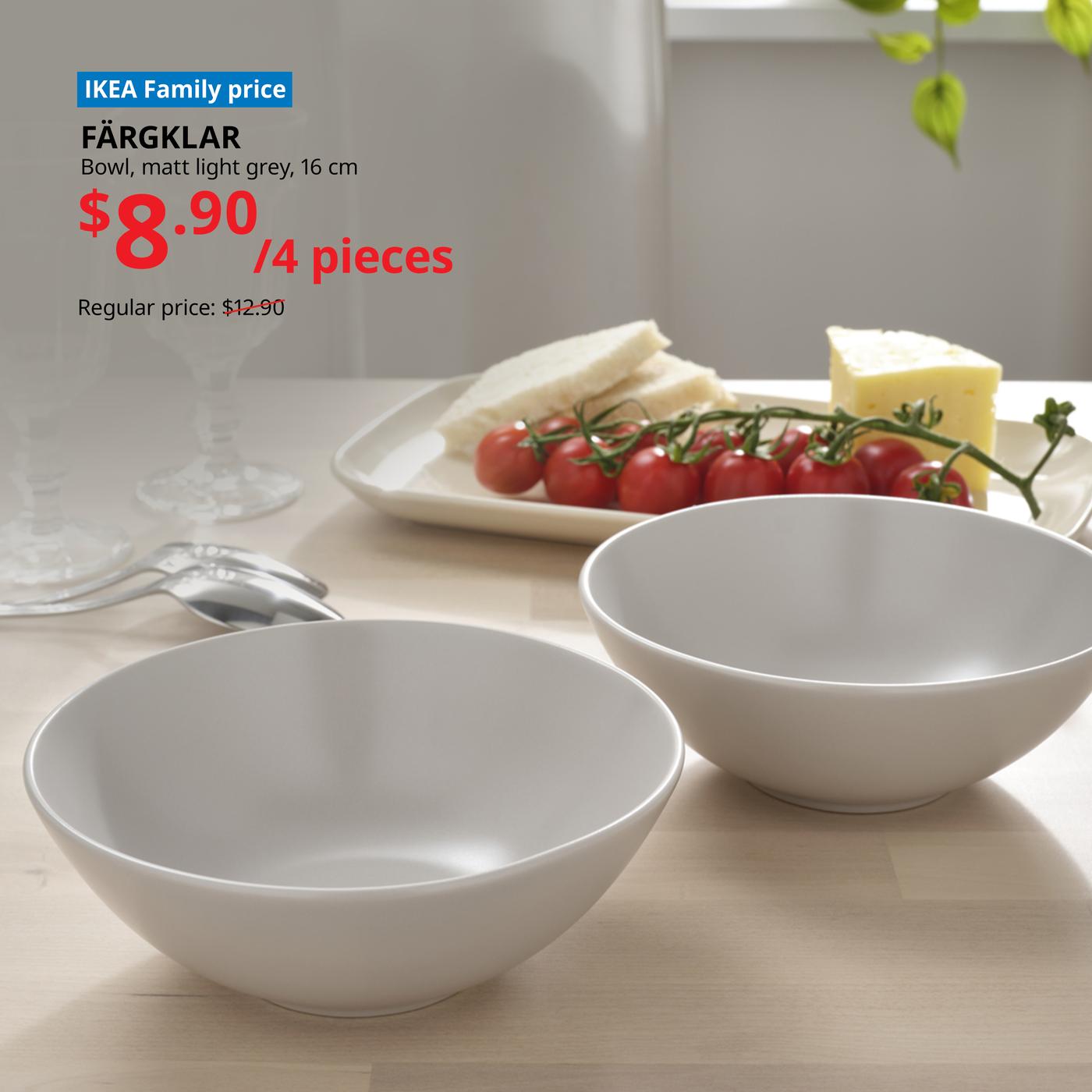 Two FARGKLAR bowls on a table with a chesse platter in front of it. Words on image read "IKEA Family price, FARGKLAR, Bowl, matt light grey, 16cm, $8.90/4 pieces, Regular price: $12.90"
