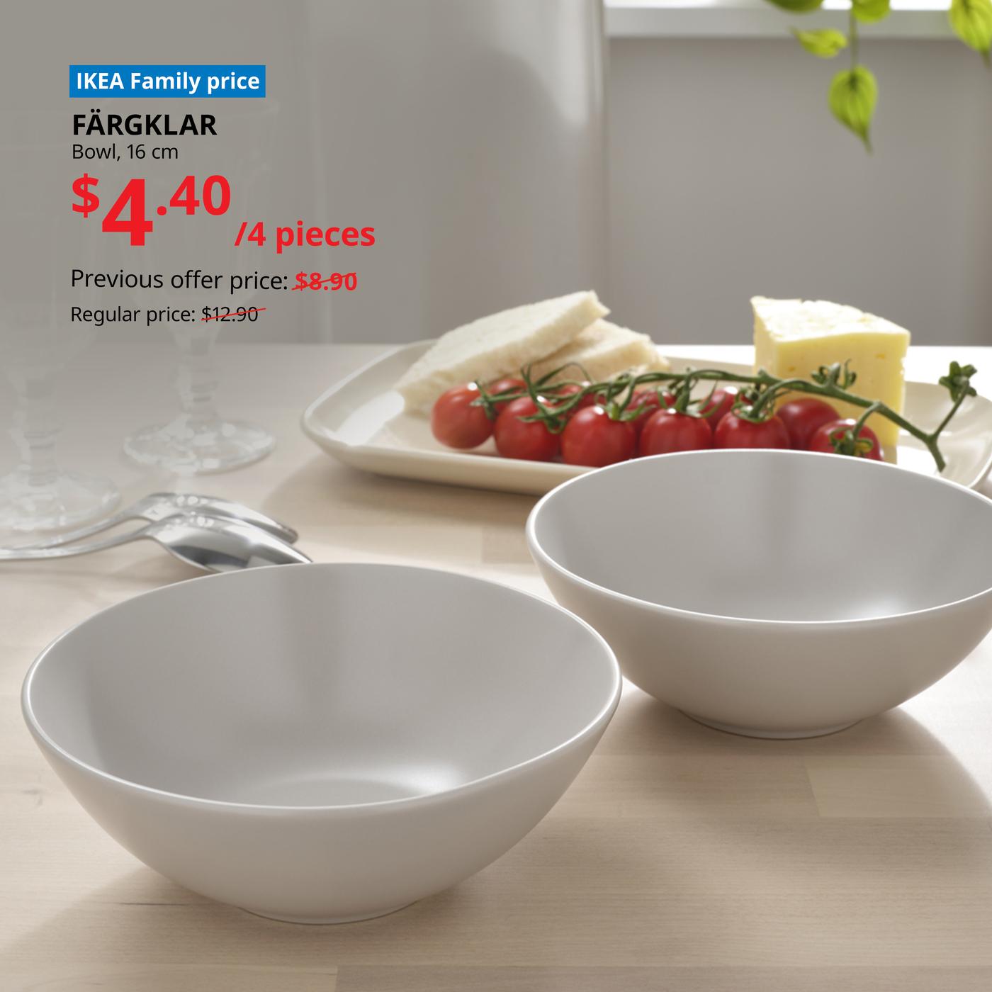 Two FARGKLAR bowls on a table with a chesse platter in front of it. Words on image read "IKEA Family price, FARGKLAR, Bowl, matt light grey, 16cm, $4.40, previous offer price $8.90/4 pieces, Regular price: $12.90"