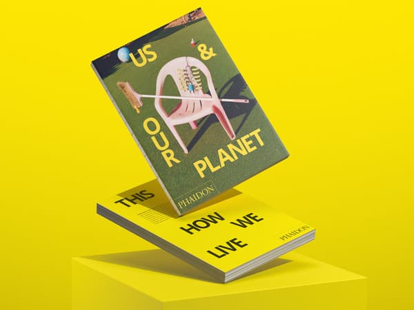 Two IKEA books floating in front of a yellow background.