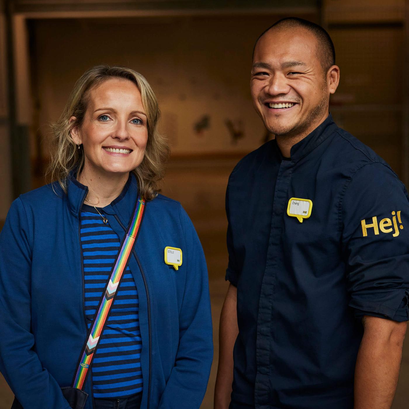 Two IKEA co-workers smiling at the camera.
