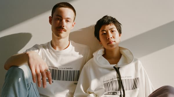 Two individuals wearing an IKEA t-shirt and jumper