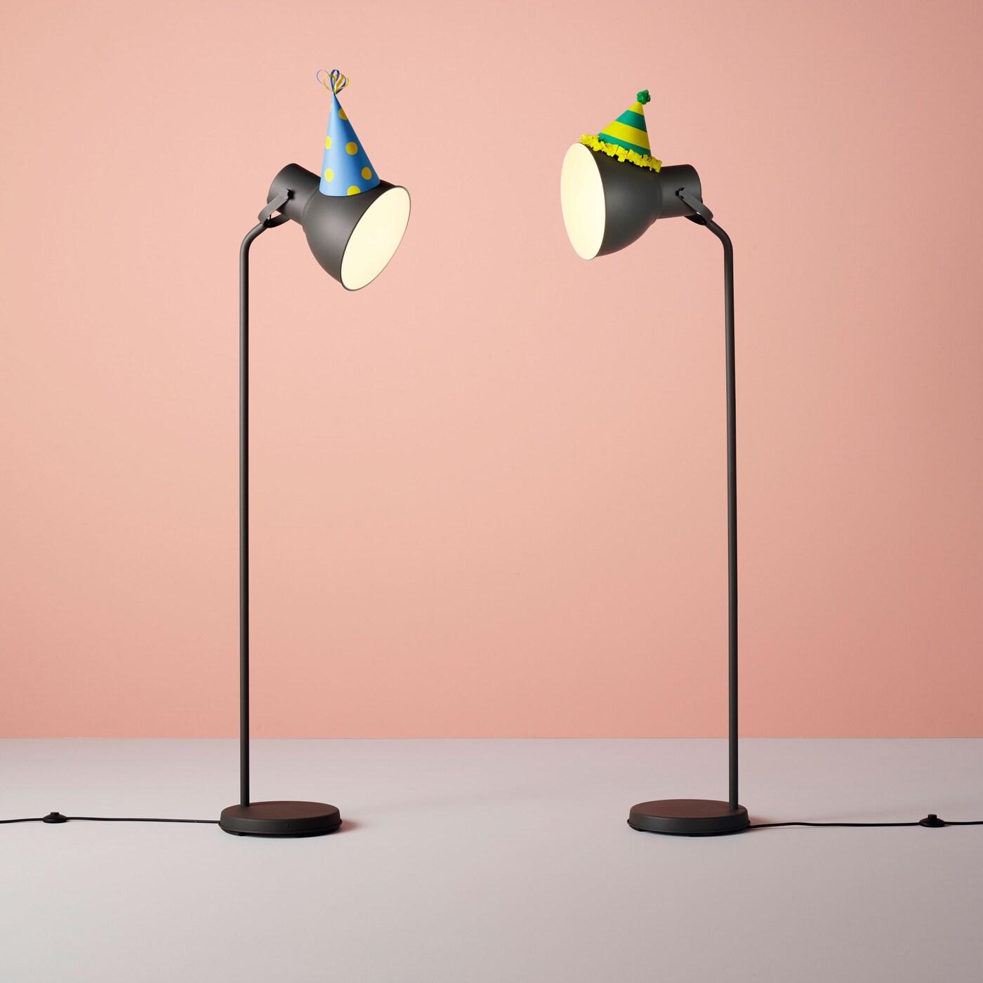 Two lamps with party hats on.