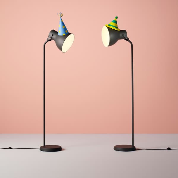 Two lamps with party hats on.