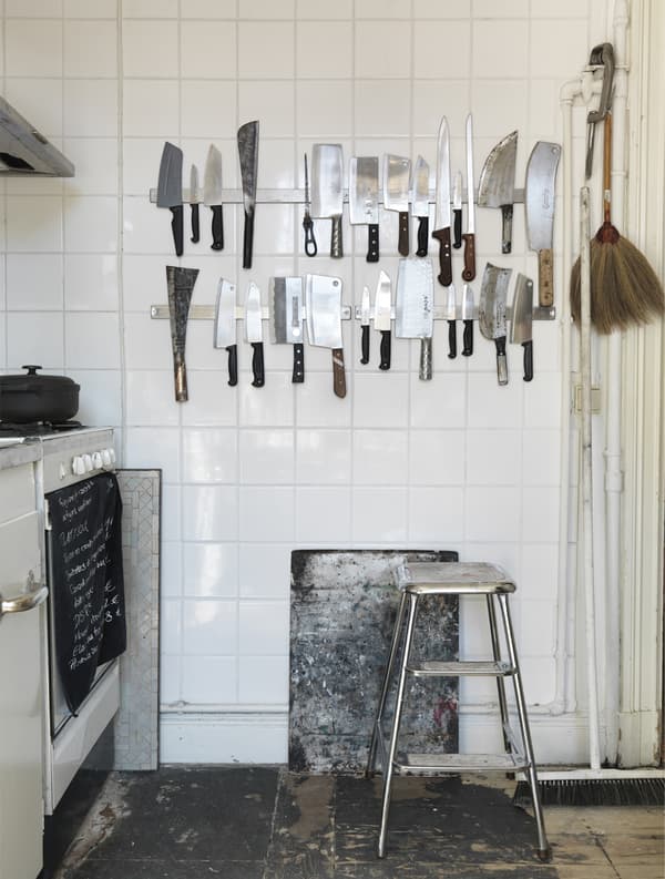 Two magnetic knife racks mounted on a wall.