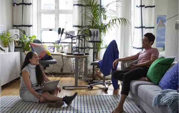 Two people in a studio bedroom.