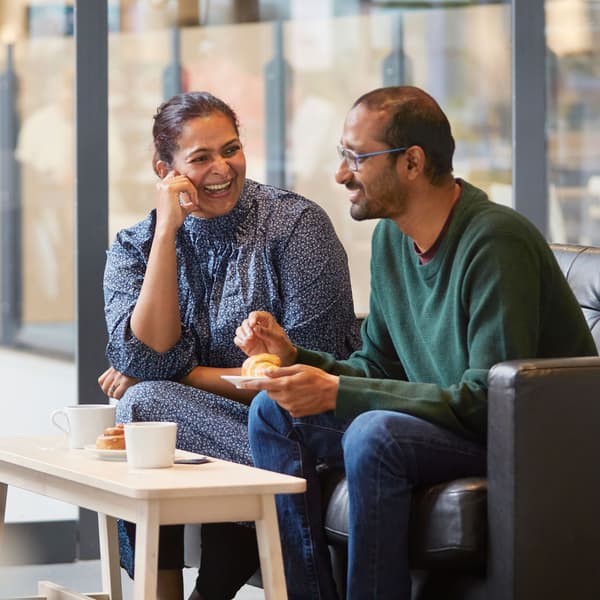 Two people smiling in the restaurant