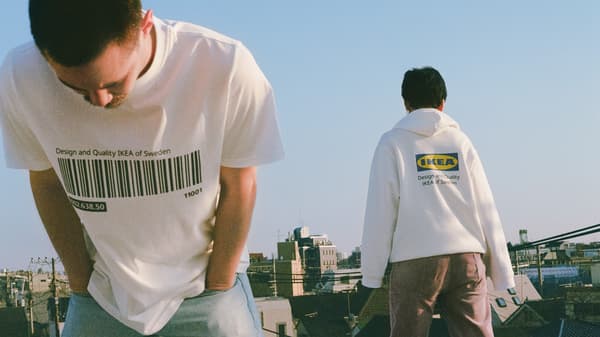 Two people wearing an IKEA branded t-shirt and jumper