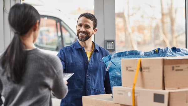 Two people with cardboard boxes