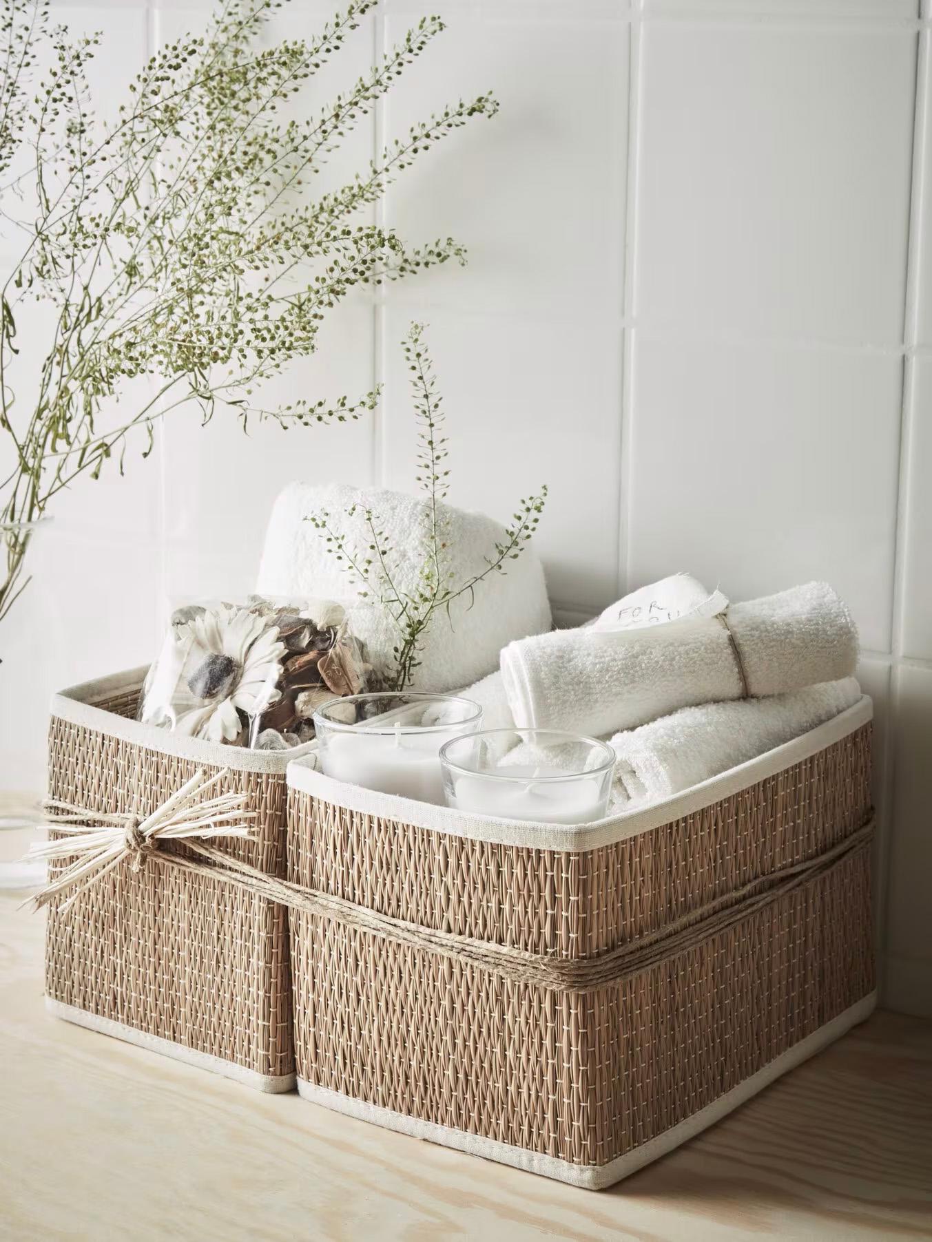 Two wicker baskets on a tiled floor