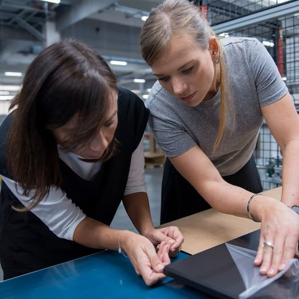 Two women working in warehouse