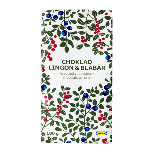 Un paquete de chocolate surtido CHOKLAD decorado con motivos azules, rojos y verdes.