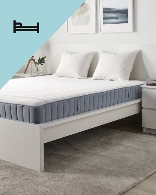 Una cama con un colchón IKEA y en el costado superior izquierdo de la foto un ícono de cama.