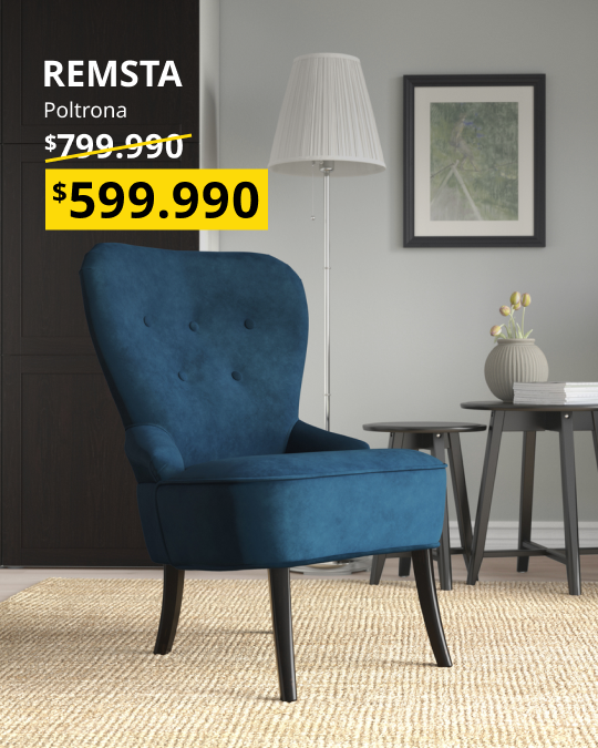 Una poltrona REMSTA azul con patas negras.