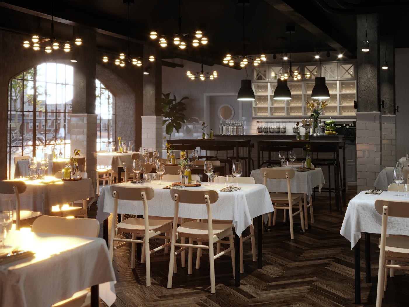 Uno spazioso ristorante con sedie RÖNNINGE in betulla e tavoli TOMMARYD con tovaglie bianche apparecchiate con bicchieri e posate - IKEA.