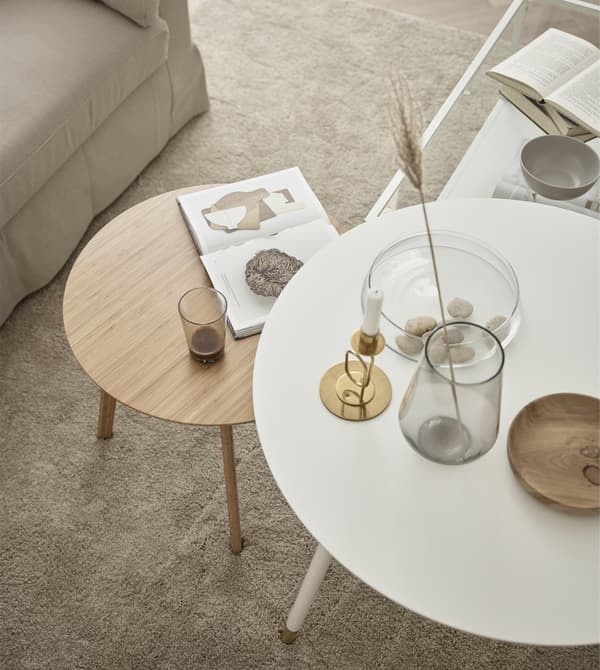 Use a few smaller tables in different shapes, instead of just one larger coffee table.