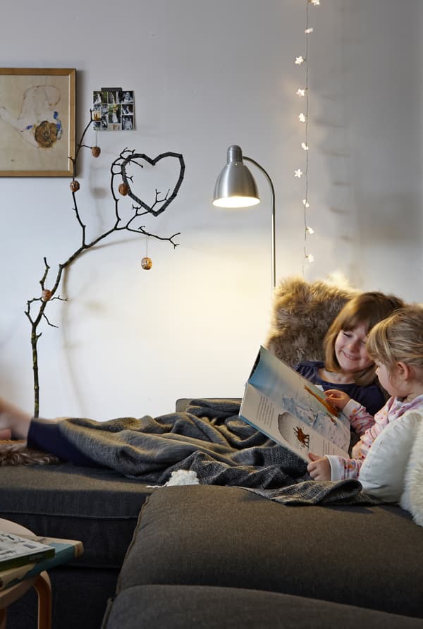 Use cosy throws, cushions and lights.
