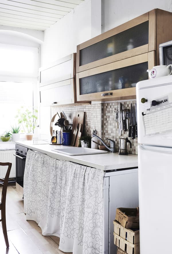 Use textiles to hide your washing machine or dishwasher.