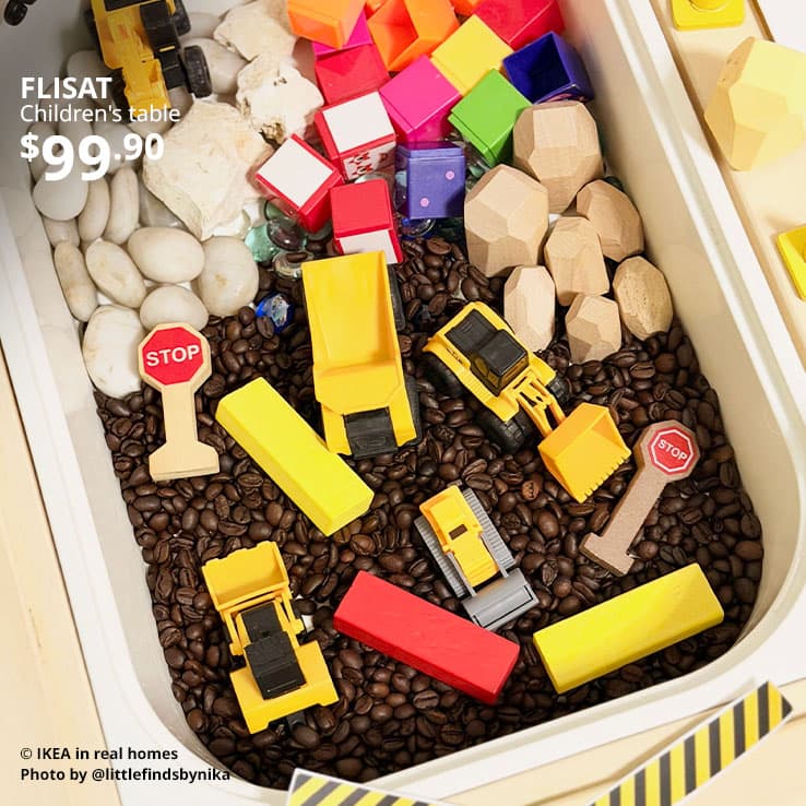 User generated content. Coffee beans and and an assortment of children's toys in a TROFAST shelf within a FLISAT children's table, for sensory play. Price: $99.90