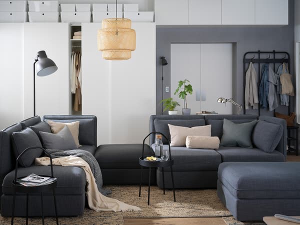 VALLENTUNA sofa and white cabinets in the living room.