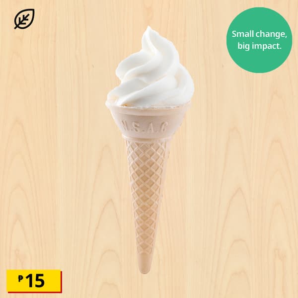 Vanilla soft-serve ice cream cone on light wood, with an eco leaf icon, “Small change, big impact” message, ₱15 price, and cheerful tone.
