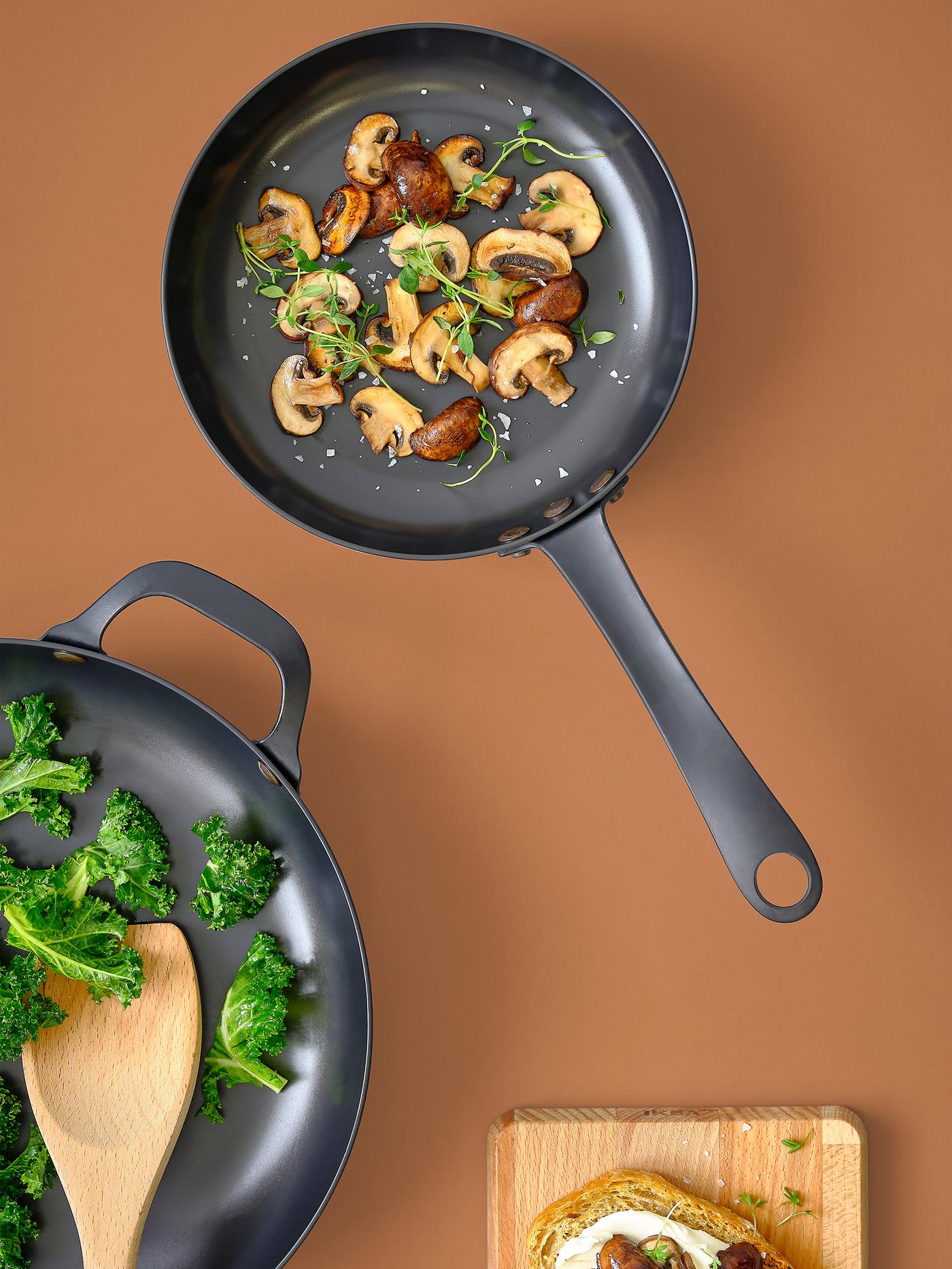 VARDAGEN carbon steel pan with food in it.