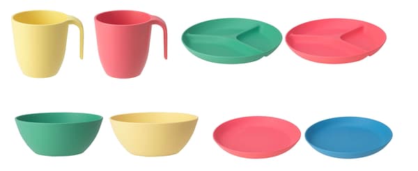 Varios tazones, platos y tazas verdes, amarillos, rosas y azules de la serie HEROISK alineados sobre un fondo blanco.