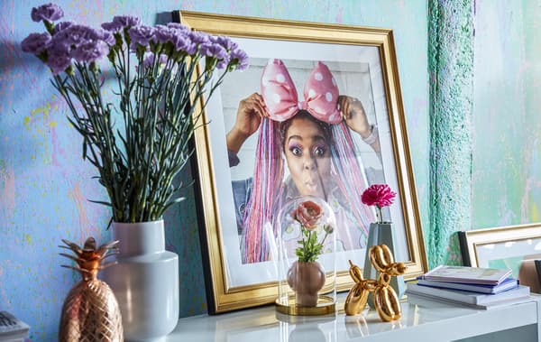 Vases, pots, ornaments and a picture of Amina.