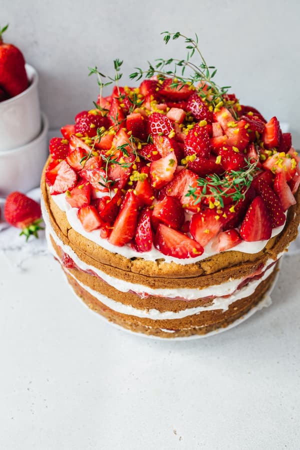 Vegan Strawberry Naked Cake decorated with fresh strawberries