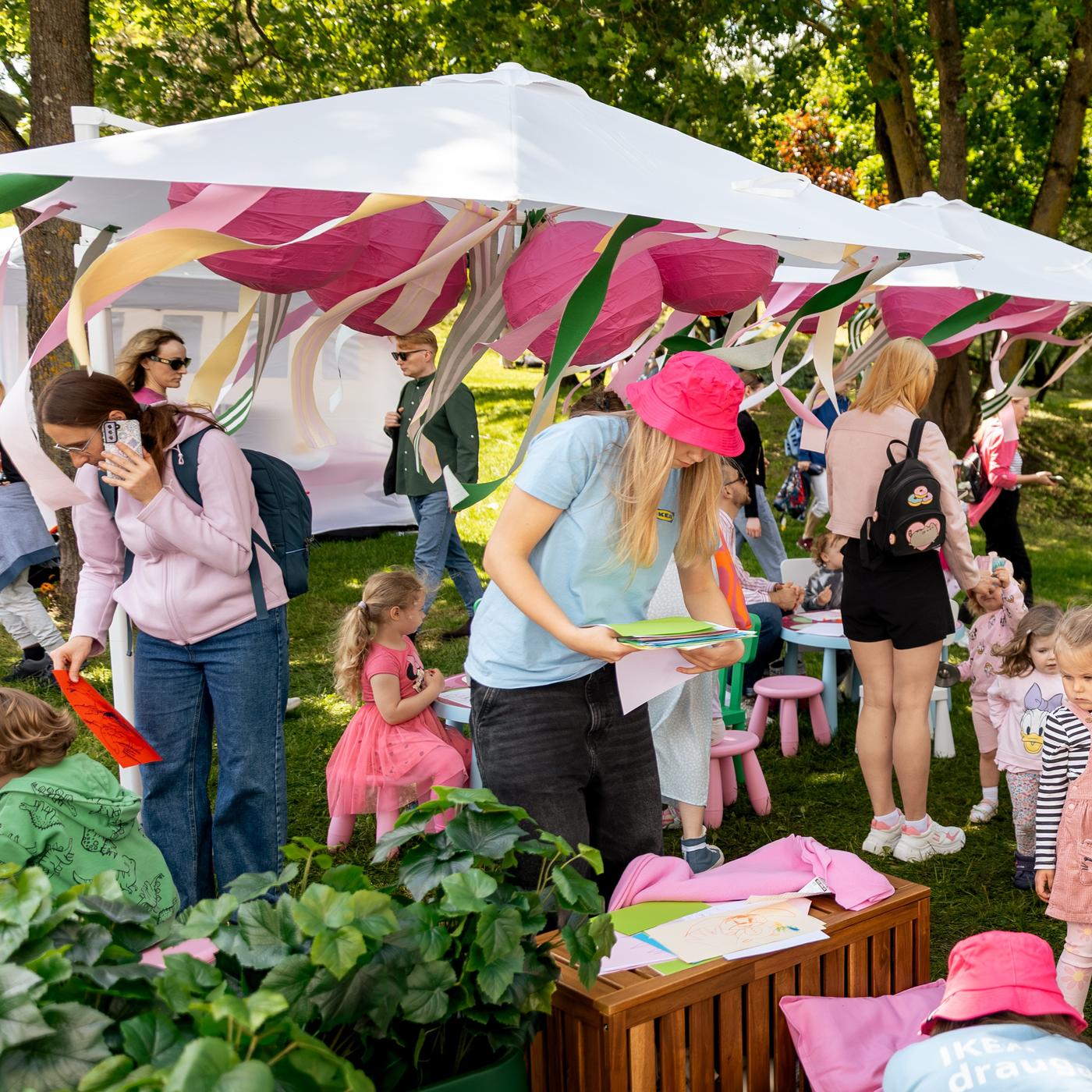 Vendors serving food under a canopy at the Pink Soup Festival.