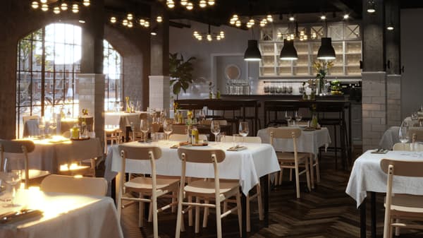 Verschiedene gedeckte TOMMARYD Tische mit weissen Tischdecken, Gläsern und Blumen in Vasen stehen in einem grosszügigen Restaurant.
