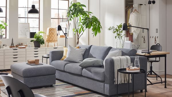 VIMLE sofa-bed in Gunnared medium grey, PAX wardrobes and ALEX drawer units in a one-room city apartment.