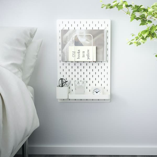 Wall panel acts as a bedside table.